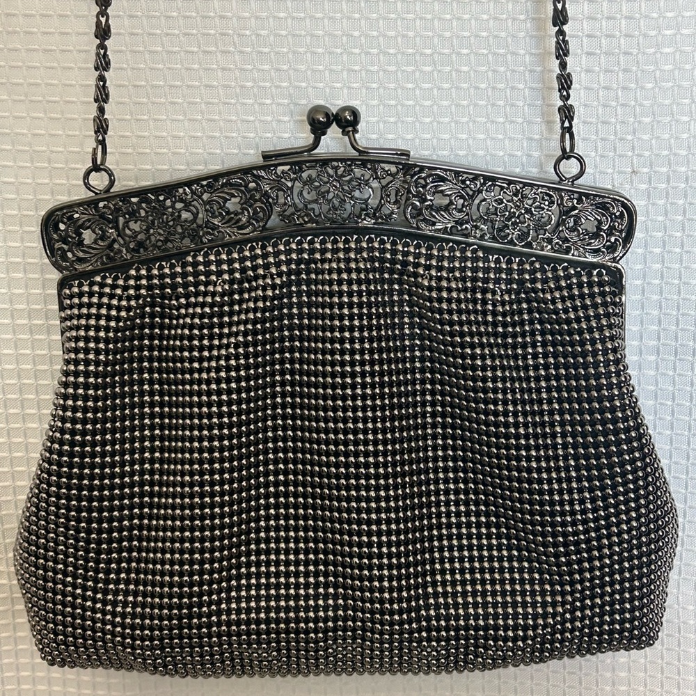 Vintage Talbots black evening bag featuring chain strap and a classic kiss lock